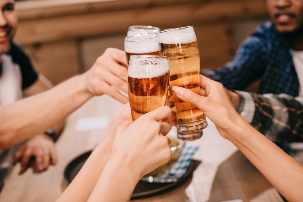 Friends toasting with glasses of beer